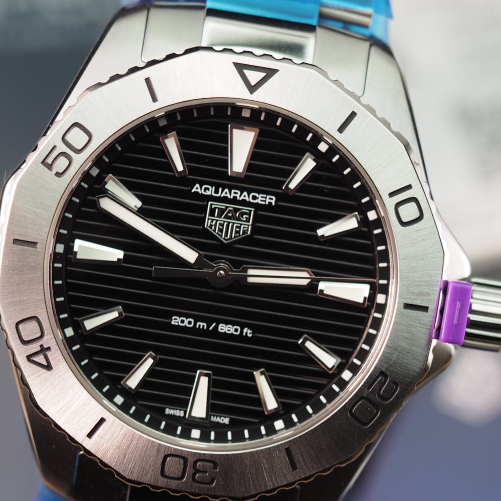 Breitling colt vs tag heuer aquaracer outlet